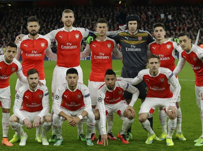 The Arsenal team line up for a photograph just prior to the start of the Champions League round of 16 first leg soccer match between Arsenal and Barcelona at the Emirates stadium London, Tuesday, Feb. 23, 2016. (AP Photo/Matt Dunham)