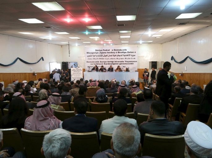 Bureau members of a preparatory conference to announce a federal system discuss a "Democratic Federal System for Rojava - Northern Syria" in the Kurdish-controlled town of Rmeilan, Hasaka province, Syria March 16, 2016. REUTERS/Rodi Said