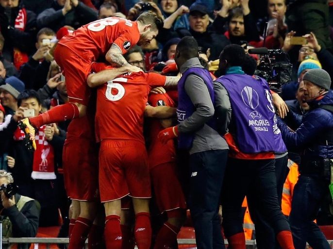 Liverpool players celebrate after scoring his side’s second goal during the Europa League round of 16, first leg, soccer match between Liverpool and Manchester United at Anfield Stadium, Liverpool, England, Thursday March 10, 2016. (AP Photo/Jon Super)