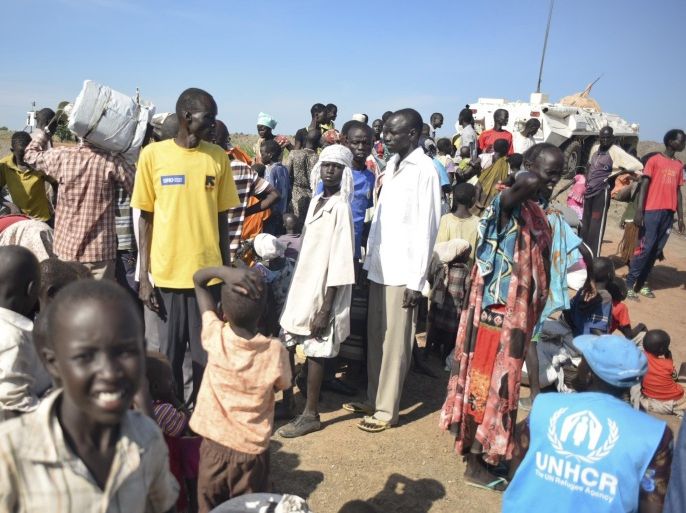 In this photo taken Monday, June 29, 2015, newly-arrived displaced people register to receive food and other aid at the UN base in Bentiu, South Sudan. South Sudan’s army has burned people alive, raped and shot girls, and forced tens of thousands from their homes, according to interviews with survivors by The Associated Press and corroborated by human rights groups. (AP Photo/Jason Patinkin)