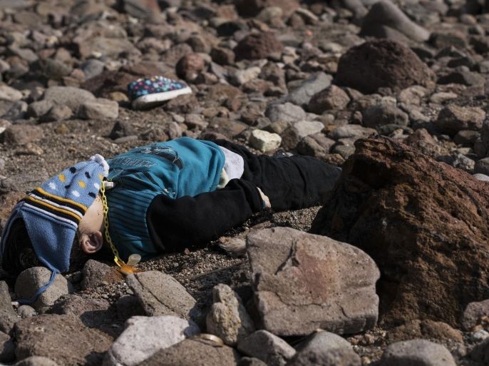 File - In this Saturday, Jan. 30, 2016 file photo, the lifeless body of a migrant boy lies on the beach near the Aegean town of Ayvacik, Canakkale, Turkey. Have we hardened so much, so fast? Five months ago, a 3-year-old Syrian boy’s corpse on a Turkish beach galvanized public action. Now, strikingly similar images are generating little more than a collective shrug. (AP Photo/Halit Onur Sandal, File)