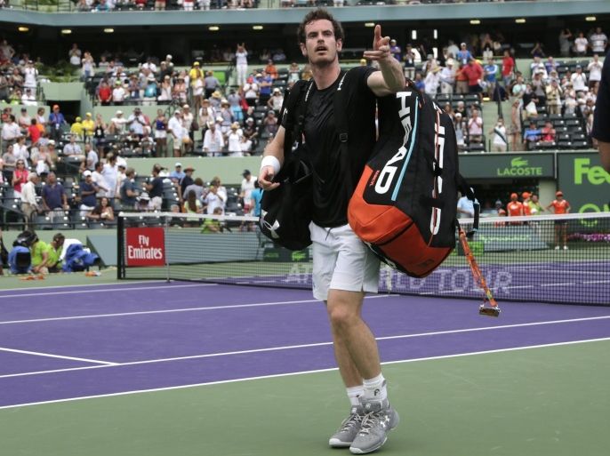 Andy Murray, of Britain, throws his sweatband to the crowd after his match against Grigor Dimitrov at the Miami Open tennis tournament, Monday, March 28, 2016, in Key Biscayne, Fla. Dimitrov won. (AP Photo/Lynne Sladky)