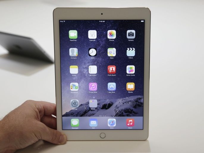 FILE - In this Oct. 16, 2014 file photo, the iPad Air 2 is displayed for journalists at Apple headquarters in Cupertino, Calif. Apple's tablet computing device, once a red-hot consumer gadget, has suffered from a steady decline in sales over the last year. (AP Photo/Marcio Jose Sanchez, File)