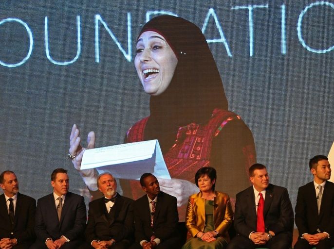 The finalists listen to Palestinian primary school teacher Hanan al-Hroub speak after she won the second annual Global Teacher Prize, in Dubai, United Arab Emirates, Sunday, March 13, 2016. Al-Hroub who encourages students to renounce violence won a $1 million prize for teaching excellence. (AP Photo/Kamran Jebreili)