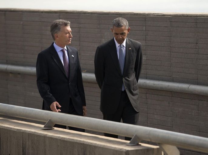 President Barack Obama and Argentine President Mauricio Macri walk during their visit to Parque de la Memoria (Remembrance Park) in Buenos Aires, Argentina, Thursday, March 24, 2016. Obama visited the memorial to victims of the country's murderous US-backed dictatorship who were killed or went missing from 1976-1983. (AP Photo/Pablo Martinez Monsivais)