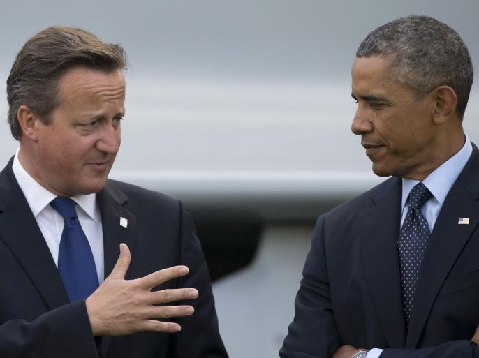 FILE - This is a Friday, Sept. 5, 2014 file photo of U.S. President Barack Obama, right, as he speaks with British Prime Minister David Cameron during a flypast at the NATO summit at the Celtic Manor Resort in Newport, Wales. The British press on Friday March 11, 2016 has accused President Obama of launching a verbal attack on Prime Minister David Cameron. Obama's comments in a magazine interview were called 'unprecedented' and 'extraordinary.' The hubbub has pushed the White House into damage control mode and US officials issued a statement asserting close ties between the leaders. (AP Photo/Jon Super, File)