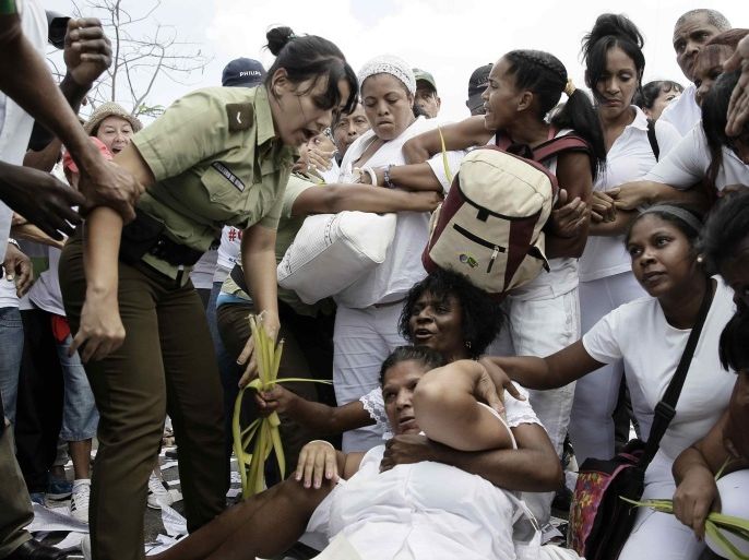 Members of the 'Damas de Blanco' (Ladies in White) opposition movement are arrested by police after a rally in Havana, Cuba, 20 March 2016. About fifty Damas de Blanco members and other dissidents were arrested in the Cuban capital after the weekly Sunday rally of the female dissident group, which was answered with a counter-demonstration of government supporters, a few hours ahead of the arrival of US President Barack Obame for the first visit of an US President in 88 years to the island.
