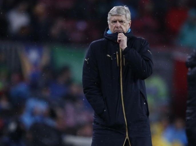 Arsenal's manager Arsene Wenger walks alongside the pitch during the Champions League round of 16 second leg soccer match between FC Barcelona and Arsenal FC at the Camp Nou stadium in Barcelona, Spain, Wednesday, March 16, 2016. (AP Photo/Manu Fernandez)