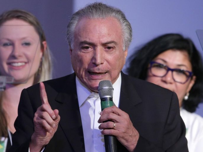 Brazil’s Vice President Michel Temer, speaks at the Brazilian Democratic Movement Party, (PMDB), national convention in Brasilia, Brazil, Saturday, March 12, 2016. The PMDB is considering abandoning its alliance with the Workers' Party that began during the government of Dilma Rousseff's predecessor, Luiz Inacio Lula da Silva. (AP Photo/Eraldo Peres)