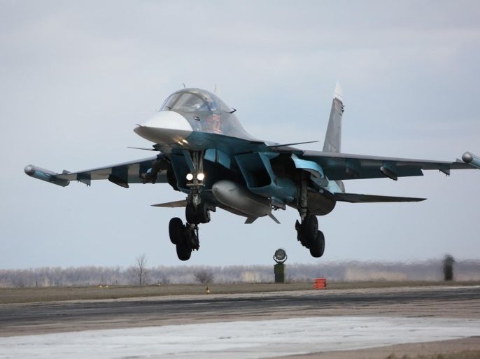 In this photo provided by the Russian Defense Ministry Press Service, Russian Su-34 bomber lands after returning from Syria at an airbase near the Russian city Voronezh, Tuesday, March 15, 2016. Russian warplanes and troops stationed at Russia's air base in Syria started leaving for home on Tuesday after a partial pullout order from President Vladimir Putin the previous day, a step that raises hopes for progress at the newly reconvened U.N.-brokered peace talks in Geneva. (Olga Balashova/Russian Defense Ministry Press Service via AP)