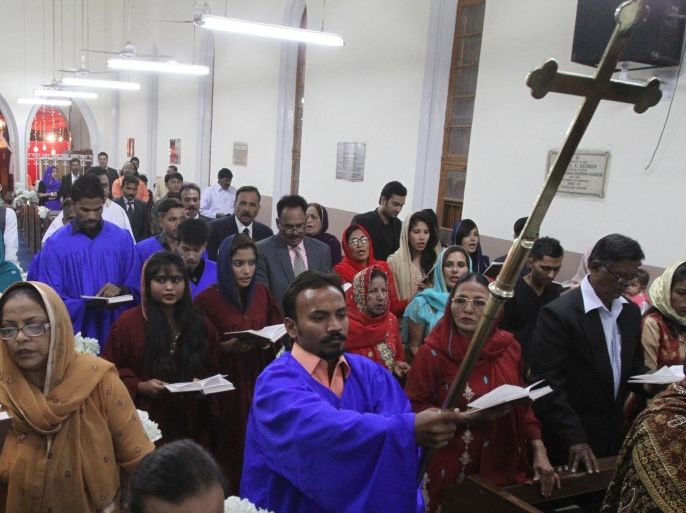 Pakistani Christians attend the Christmas mass at a local church, Friday, Dec. 25, 2015 in Karachi, Pakistan. (AP Photo/Fareed Khan)