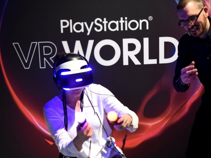 A woman demos Sony's PlayStation VR during an event in San Francisco, California March 15, 2016. REUTERS/Noah Berger