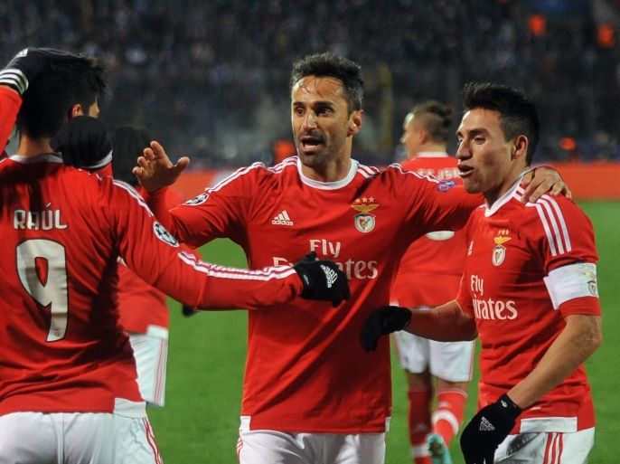 MOW5559 - St. Petersburg, -, RUSSIAN FEDERATION : Benfica's players celebrate a goal during the second-leg round of 16 UEFA Champions League football match FC Zenit vs SL Benfica at the Petrovsky stadium in St. Petersburg on March 9, 2016. AFP PHOTO / OLGA MALTSEVA