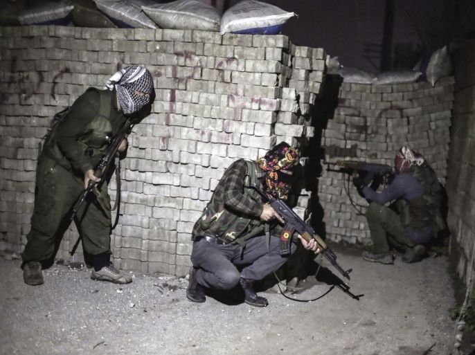 In this photo dated Thursday Feb. 25, 2016, militants of Kurdistan Workers' Party, PKK, move to attack Turkish security forces in Nusaybin, south Turkey, Thursday, Feb. 25, 2016. Turkish authorities say a curfew in southeastern Turkey will be lifted at 5 a.m. on Wednesday March 2, 2016. (AP Photo/Cagdas Erdogan)