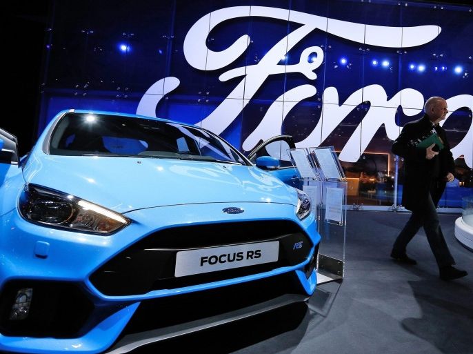 (FILE) A file photo dated 13 January 2016 showing visitors at the Ford showroom during the inauguration of the Brussels Motor Show in Brussels, Belgium. Ford on 28 April 2016 reported better than expected record 1st quarter 2016 results, saying their revenue was 38 billion USD, while net income rose to 2,5 billion USD compared with 1,2 billion USD in same period in 2015. Ford earlier on 03 February 2016 said it would slash hundreds of jobs, mainly in Germany and Britain, in an attempt to cut costs by 200 million USD annually and increase profitability.