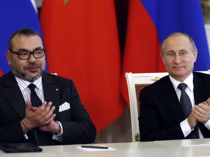 Russian President Vladimir Putin, right, and Morocco's King Mohammed VI attend a signing ceremony after their talks in the Kremlin in Moscow, Russia, Tuesday, March 15, 2016. Morocco's King Mohammed VI is on an official visit to Russia. (Maxim Shipenkov/Pool photo via AP)