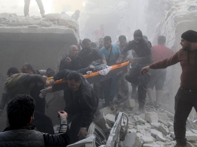ATTENTION EDITORS - VISUAL COVERAGE OF SCENES OF DEATH AND INJURY Residents and Civil Defense members carry the body of an elderly woman on a stretcher amidst rubble of damaged buildings after an air strike on the rebel held al-Saliheen district in Aleppo, Syria, March 11, 2016. REUTERS/Abdalrhman Ismail