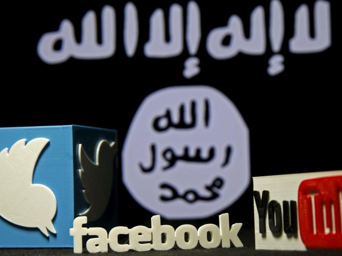 A 3D plastic representation of the Twitter and Youtube logo is seen in front of a displayed ISIS flag in this photo illustration in Zenica, Bosnia and Herzegovina, February 3, 2016. Iraq is trying to persuade satellite firms to halt Internet services in areas under Islamic State's rule, seeking to deal a major blow to the group's potent propaganda machine which relies heavily on social media to inspire its followers to wage jihad. Picture taken February 3, 2016. To match Insight MIDEAST-CRISIS/IRAQ-INTERNET REUTERS/Dado Ruvic