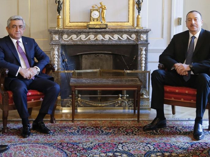 Ilham Aliyev, president of Azerbaijan, right, and Serzh Sargsyan, president of Armenia, left, meet for talks about the Nagorno-Karabakh conflict, in Bern, Switzerland, Saturday, Dec. 19, 2015. (Peter Klaunzer,Pool Photo via AP)