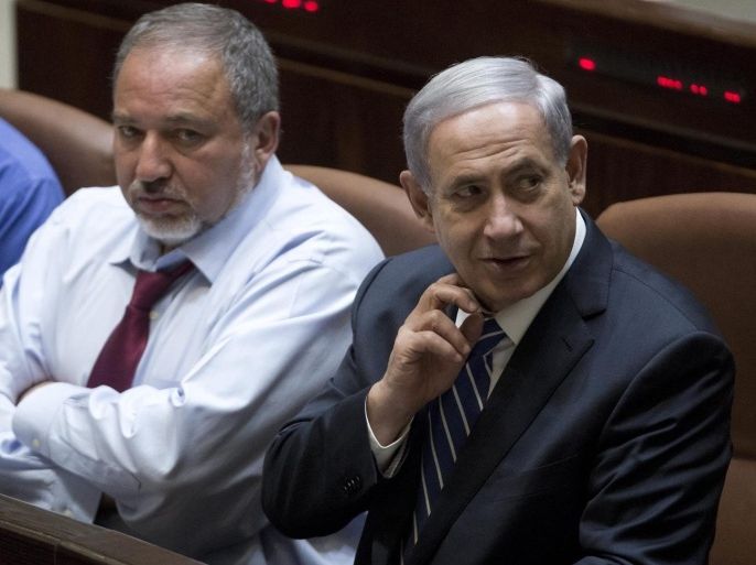 Israeli Prime Minister Benjamin Netanyahu (R), Israeli Foreign Minister Avigdor Lieberman (C) and Israeli Defense Minister Moshe Ya'alon (L) attend the 2015 budget voting at the Israeli Knesset plenum in Jerusalem, Israel, 10 November 2014. Media reports on the possibility of early primaries due to controversies between the parties of the Israeli Parliament.