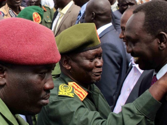 General Simon Gatwech Dual (C), the chief of staff of the South Sudan rebel troops, is received by unidentified officials upon arrival in Juba, South Sudan, 25 April 2016. Reports state General Simon Gatwech Dual, the chief of staff of the Sudan People's Liberation Movement-in-Opposition (SPLM-IO), the rebel group led by former vice-president of South Sudan Riek Machar, arrived in Juba along with 195 soldiers ahead of a planned return of Machar as part of a peace agreement.