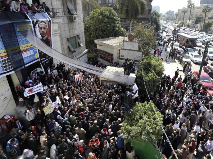 Lawyers shout slogans against the Interior Ministry during a protest in front of the Lawyers' Syndicate headquarters in Cairo, March 1, 2015, after the death of lawyer Karim Hamdy in the Police Department last week. Two Egyptian policemen accused of killing a lawyer in custody were detained on Thursday on the orders of an Egyptian prosecutor, judicial sources said, a rare action against members of the security forces. REUTERS/Mohamed Abd El Ghany (EGYPT - Tags: POLITICS CIVIL UNREST)