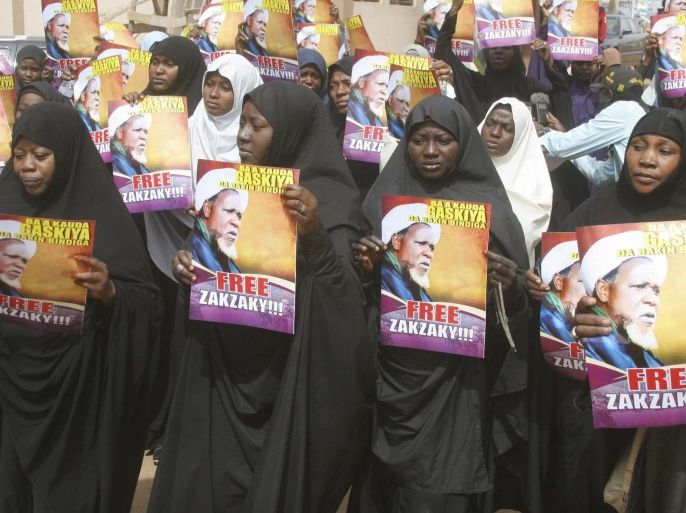 Followers react as they hold posters of Ibrahim Zakzaky during a protest demanding his release, at the offices of the Nigeria Union of Journalists (NUJ) Secretariat, in Kaduna, Nigeria January 5, 2016. Ibrahim Zakzaky, leader of the Islamic Movement in Nigeria, a minority Shi'ite sect, was arrested in December during a deadly raid by the Nigerian army, who said the sect was trying to assassinate the chief of army staff. REUTERS/StringerEDITORIAL USE ONLY. NO RESALES. NO ARCHIVE