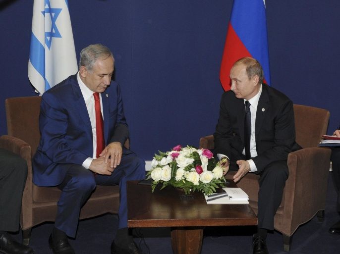 Russia's Vladimir Putin (C) meets with Israel's Prime Minister Benjamin Netanyahu (L) on the sidelines of the World Climate Change Conference 2015 (COP21) at Le Bourget, near Paris, France, November 30, 2015. REUTERS/Mikhail Klimentyev/Sputnik/Kremlin ATTENTION EDITORS - THIS IMAGE HAS BEEN SUPPLIED BY A THIRD PARTY. IT IS DISTRIBUTED, EXACTLY AS RECEIVED BY REUTERS, AS A SERVICE TO CLIENTS.