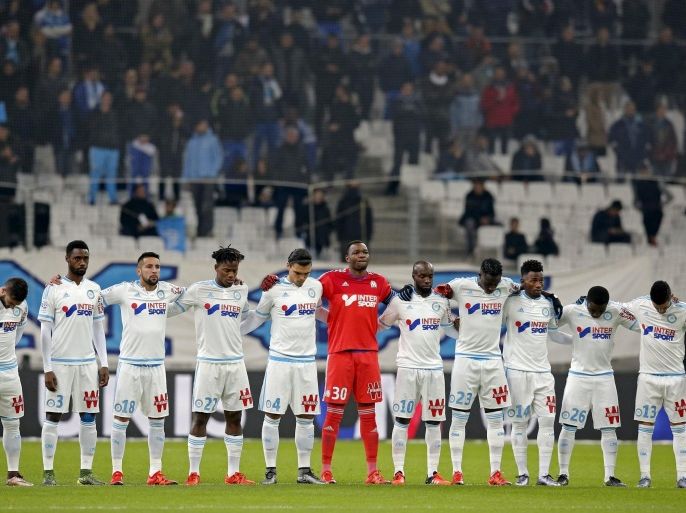 Football Soccer - Olympique Marseille v Monaco - French Ligue 1 - Velodrome stadium , 29/11/2015Olympique Marseille's players observe a minute of silence REUTERS/Jean-Paul Pelissier