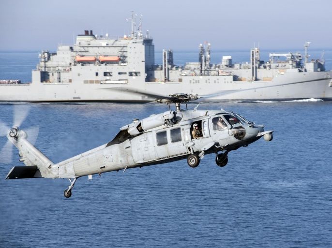 An MH-60S Sea Hawk helicopter prepares to land on the flight deck of aircraft carrier USS Harry S. Truman during a vertical replenishment in the Arabian Gulf in this U.S. Navy picture taken April 6, 2016. The U.S. Navy is leading a 30-nation maritime exercise across Middle Eastern waters which it says will help protect international trade routes against possible threats, including from Islamic State and al Qaeda. Picture taken April 6, 2016. REUTERS/U.S. Navy/Mass Communication Specialist 3rd Class Justin R. Pacheco/Handout via Reuters THIS IMAGE HAS BEEN SUPPLIED BY A THIRD PARTY. IT IS DISTRIBUTED, EXACTLY AS RECEIVED BY REUTERS, AS A SERVICE TO CLIENTS. FOR EDITORIAL USE ONLY. NOT FOR SALE FOR MARKETING OR ADVERTISING CAMPAIGNS