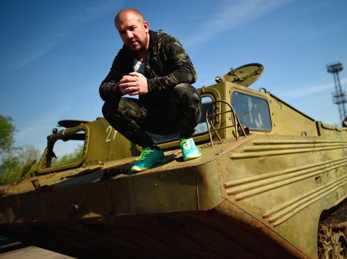 Bulgarian Dinko Valev (29), owner of a breakersyard for trucks and buses, poses on one of his old military vehicles in the town of Yambol, some 240 kilometers from Sofia, Bulgaria, 01 April 2016. The Bulgarian fan of extreme driving of All Terrain Vehicles (ATV) has become a national celebrity after he detained a group of migrants from Syria near the border with Turkey earlier this year. The 29-years old insists he is not a 'migrant hunter' as dubbed by the Bulgarian media but acted in self defence as well as a patriot protecting his country from intruders and possibly terrorists. He was gaining support from locals when he was being investigated by the prosecution office for possible anti-migrant propaganda and eventually violence againts refugees. A spokesperson for the Bulgarian Border Police told media that authorities are generally welcoming calls from citizens on irregular border crossings, but the detaining by civilians, as Valev is praising himself on his Facebook account, was an illegal act.