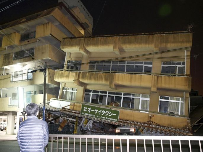 A damaged building caused by an earthquake is seen in Kumamoto, southern Japan, in this photo taken by Kyodo April 16, 2016. Mandatory credit REUTERS/Kyodo ATTENTION EDITORS - FOR EDITORIAL USE ONLY. NOT FOR SALE FOR MARKETING OR ADVERTISING CAMPAIGNS. THIS IMAGE HAS BEEN SUPPLIED BY A THIRD PARTY. IT IS DISTRIBUTED, EXACTLY AS RECEIVED BY REUTERS, AS A SERVICE TO CLIENTS. MANDATORY CREDIT. JAPAN OUT. NO COMMERCIAL OR EDITORIAL SALES IN JAPAN. TPX IMAGES OF THE DAY