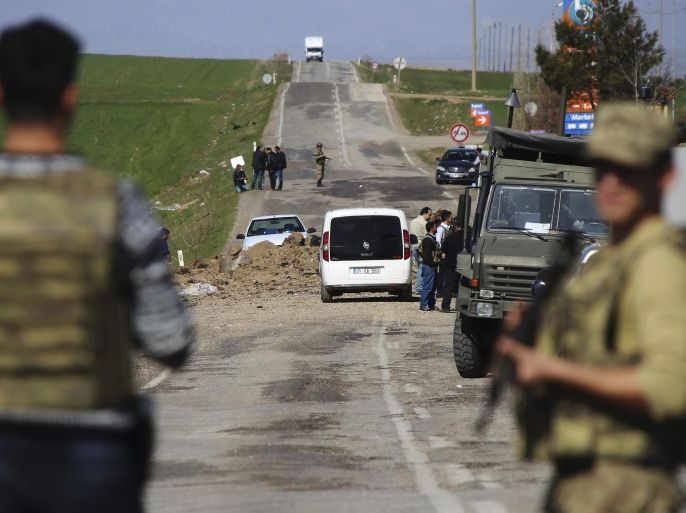 Members of Turkish forces secure the scene of an explosion on the road linking the cities of Diyarbakir and Bingol, in southeastern Turkey, Thursday, Feb. 18, 2016. Six soldiers were killed after PKK rebels detonated a bomb on the road as their vehicle was passing by, according to Turkey’s state-run Anadolu Agency.The deaths come a day after a suicide bombing claimed the lives of at least 28 people and wounded dozens of others. (AP Photo/Mahmut Bozarslan)
