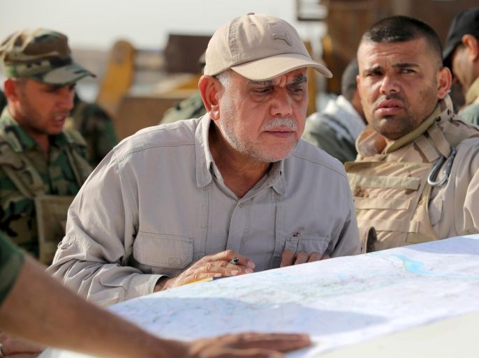 Head of the Badr Organisation and Shi'ite paramilitary commander Hadi al-Amiri follows up military plans in al Nibaie, in Anbar province, Iraq in this May 26, 2015 file photo. To match Special Report MIDEAST-CRISIS/IRAQ-MILITIAS REUTERS/Stringer/Files