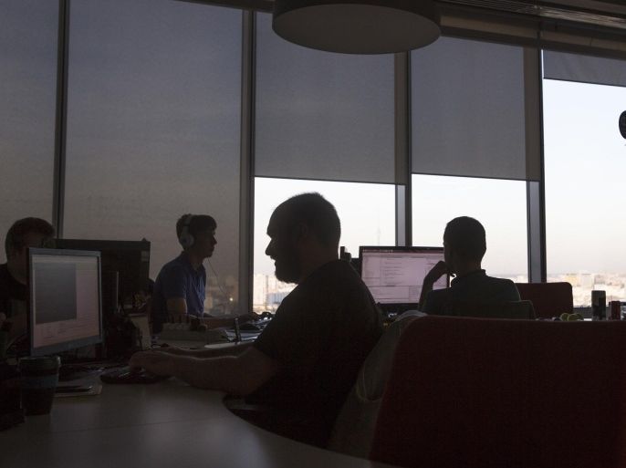 In this photo taken on Friday, Sept. 25, 2015, Mail.Ru Group employees work in a working room in their office building in Moscow, Russia. Mail.Ru Group is an the largest Internet company in the Russian-speaking world operates social networking sites, IM networks, email services, and internet portals. The government have pushed through a slew of new laws to strengthen its control over the Internet, which President Vladimir Putin has described as a “CIA project.” Some of the laws, including those giving the government broad leeway to block websites and blogs, have proven possible to get around. (AP Photo/Alexander Zemlianichenko)