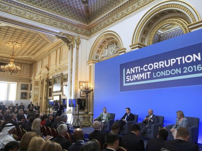 (L-R) Sarah Chayes from the Carnegie Endownment for International Peace,British Prime Minister Cameron, Afghan President Ghani and French magistrate Eva Jolly share a platform at the international anti-corruption summit, London, Britain, May 12, 2016. REUTERS/Paul Hackett