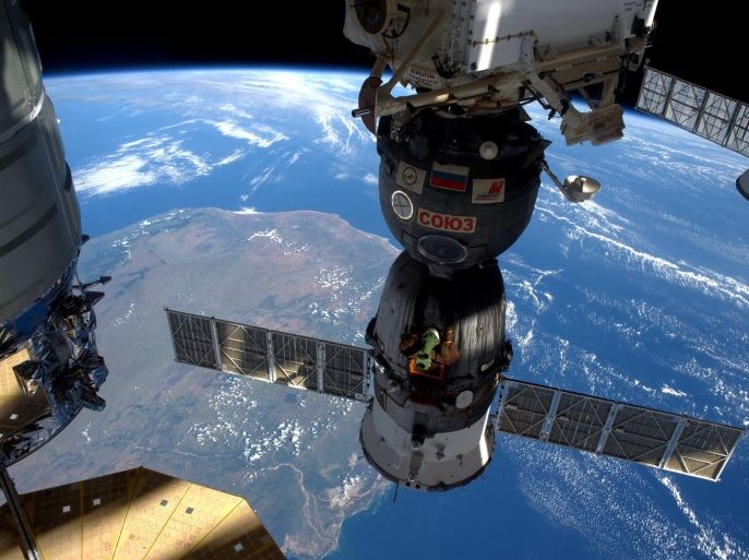 A handout picture made available by NASA on 09 April 2016 shows a view of the International Space Station (ISS) flying over Madagascar, 06 April 2016, showing three of the five spacecraft currently docked to the station. The ISS crew is waiting for the SpaceX Dragon cargo spacecraft, which will be the sixth spacecraft docked following its arrival and installation to the Harmony module on 10 April. Dragon will bring supplies and hardware as well as the Bigelow Expandable Activity Module (BEAM). The BEAM will be attached to the Tranquility module for a series of habitability tests over two years. EPA/ESA/NASA/TIM PEAKE