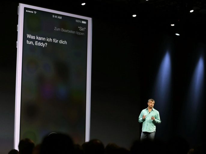 Eddy Cue, the Apple senior vice president of Internet Software and Services, talks about the new voices of Siri virtual assistant during the keynote address of the Apple Worldwide Developers Conference Monday, June 10, 2013 in San Francisco. Apple said the Siri will use searches from Microsoft's Bing, Google's rival, in addition to having a male and foreign language option. (AP Photo/Eric Risberg)