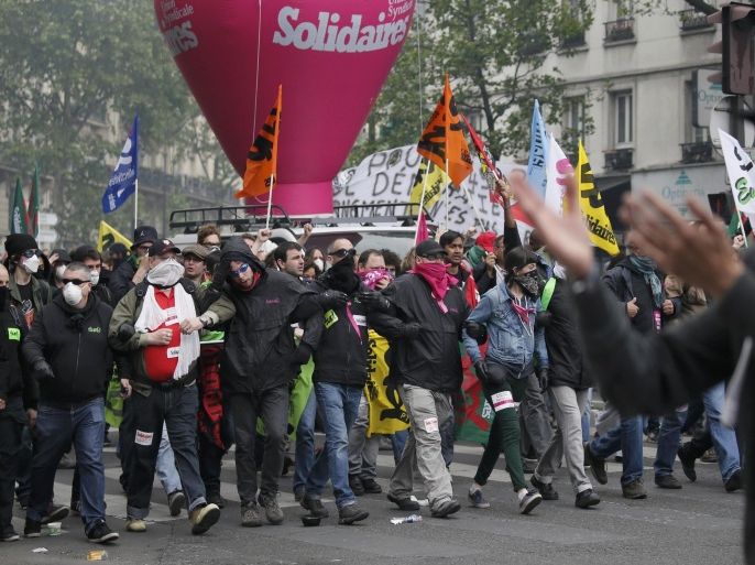 Protestors march during a demonstration against French labour law reform in Paris, France, May 12, 2016. REUTERS/Gonzalo Fuentes