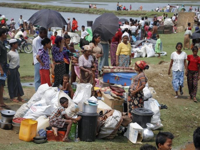 Rohingya people gather near their belongings during a fire accident at a Baw Du Ba Muslim (Rohingya) internally displaced person (IDPs) camp near Sittwe, Rakhine State, western Myanmar, 03 May 2016. The fire broke out in the morning of 03 May 2016 at Rohingya IDPs camp which burned down 55 buildings, each with 8 rooms, making 1744 IDPs from 435 households homeless.