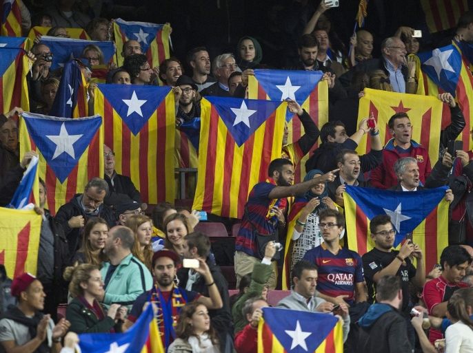 FC Barcelona's supporters hold pro-Catalan independence flags during the UEFA Champions League match between FC Barcelona and FC Bate Borisov at Camp Nou stadium in Barcelona, Catalonia, Spain, 04 November 2015.