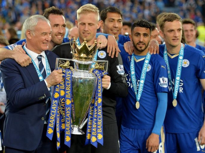 Leicester City's manager Claudio Ranieri (L) with Leicester City's goalkeeper Kasper Schmeichel (C), Riyad Mahrez (CR) and Andy King (R) lift the Premier League trophy after the English Premier League match between Leicester City and Everton at the King Power stadium Leicester in Leicester, Britain, 07 May 2016. EPA/PETER POWELL EDITORIAL USE ONLY. No use with unauthorized audio, video, data, fixture lists, club/league logos or 'live' services. Online in-match use limited to 75 images, no video emulation. No use in betting, games or single club/league/player publications