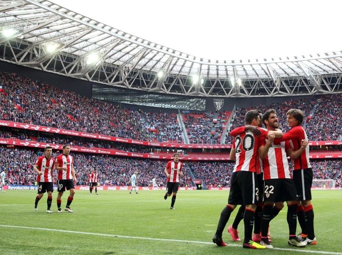 Athletico Bilbao's forward Raul Garcia (2-R) celebrates the 2-1 against Celta de Vigo during their Spanish Primera Division League soccer agmatch at the San Mames stadium in Bilbao, northern Spain, 01 May 2016.