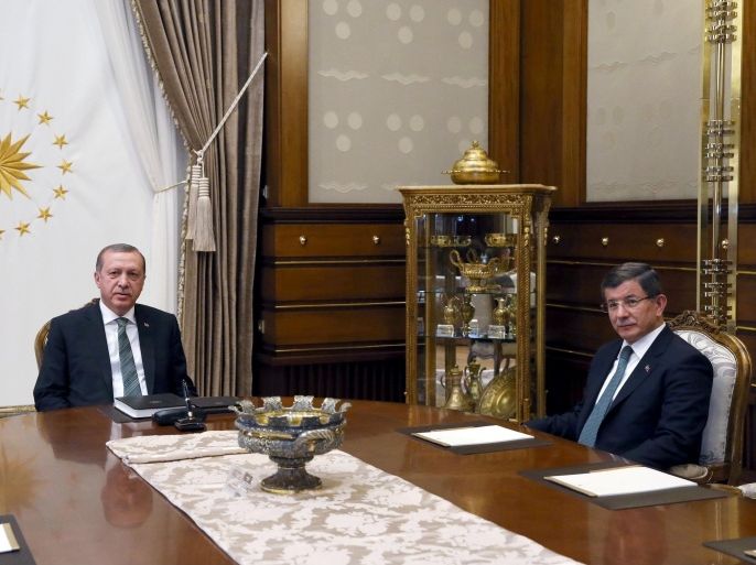 Turkish President Tayyip Erdogan (L) meets with Prime Minister Ahmet Davutoglu at the Presidential Palace in Ankara, Turkey May 4, 2016. Murat Cetinmuhurdar/Presidential Palace/Handout via REUTERS ATTENTION EDITORS - THIS PICTURE WAS PROVIDED BY A THIRD PARTY. FOR EDITORIAL USE ONLY. NO RESALES. NO ARCHIVE.