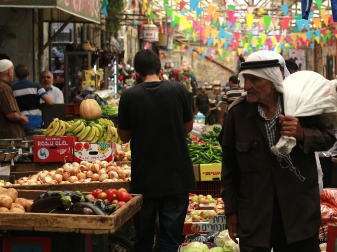 Palestinians shop at a market for the Muslim holy fasting month of Ramadan in the old city of Nablus, 07 June 2016. Muslims around the world celebrate the holy month of Ramadan by praying during the night time and abstaining from eating and drinking during the period between sunrise and sunset. Ramadan is the ninth month in the Islamic calendar and it is believed that the Koran's first verse was revealed during its last 10 nights.