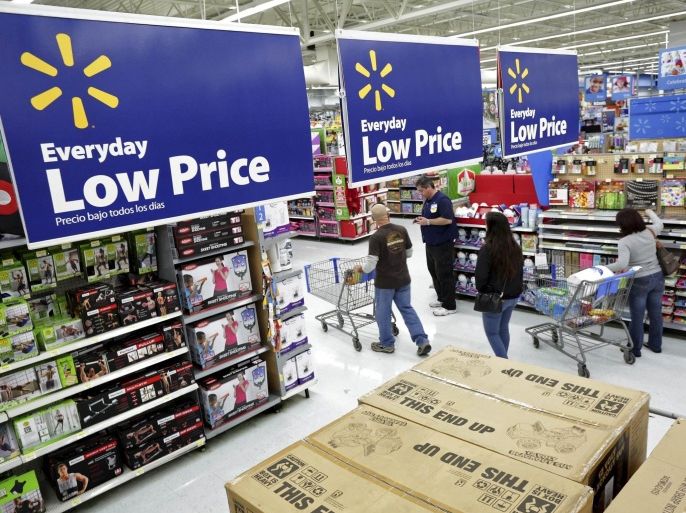 Residents shop at Walmart as the store prepares for Black Friday in Los Angeles, California in a November 24, 2014 file photo. Walmart's 2015 U.S. Manufacturing Summit was advertised as a chance for goods producers to pitch American-made products to the retail giant. They would also get advice from Walmart executives on how to take advantage of the company's recent efforts to support more U.S. manufacturing jobs and reverse the trends its purchasing strategies and dem
