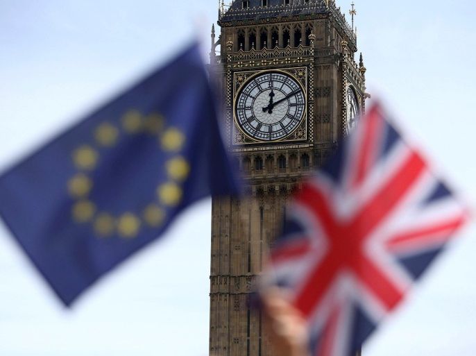 FILE PHOTO - Participants hold a British Union flag and an EU flag during a pro-EU referendum event at Parliament Square in London, Britain June 19, 2016. REUTERS/Neil Hall/File Photo TPX IMAGES OF THE DAY
