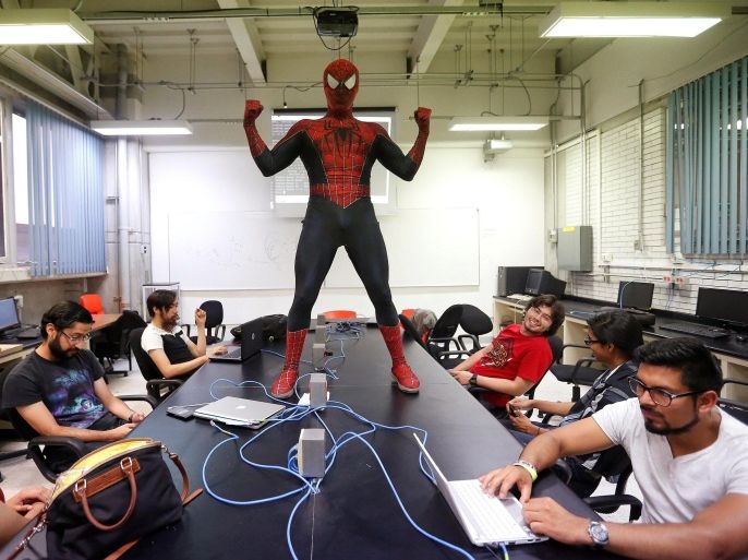 Moises Vazquez, 26, known as Spider-Moy, a computer science teaching assistant at the Faculty of Science of the National Autonomous University of Mexico (UNAM), who teaches dressed as a comic superhero Spider-Man, poses for a photograph during a class in Mexico City, Mexico, May 27, 2016. REUTERS/Edgard Garrido SEARCH "SPIDERMAN TEACHER" FOR THIS STORY. SEARCH "THE WIDER IMAGE" FOR ALL STORIES TPX IMAGES OF THE DAY