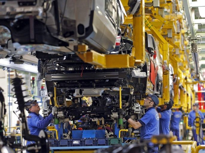 A staff member works at the Ford assembly plant in Almussafes, in the province of Valencia, eastern Spain, 05 February 2015. Ford's plant in Almussafes will rise its production to 400,000 vehicles in 2015, a 40 percent more in comparison to the previous year, Ford's President and CEO Fields announced during a visit to the automobile manufacturer's facilities in Valencia.