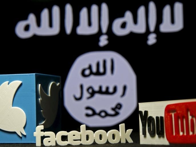 A 3D plastic representation of the Twitter and Youtube logo is seen in front of a displayed ISIS flag in this photo illustration in Zenica, Bosnia and Herzegovina, February 3, 2016. Iraq is trying to persuade satellite firms to halt Internet services in areas under Islamic State's rule, seeking to deal a major blow to the group's potent propaganda machine which relies heavily on social media to inspire its followers to wage jihad. Picture taken February 3, 2016. To ma